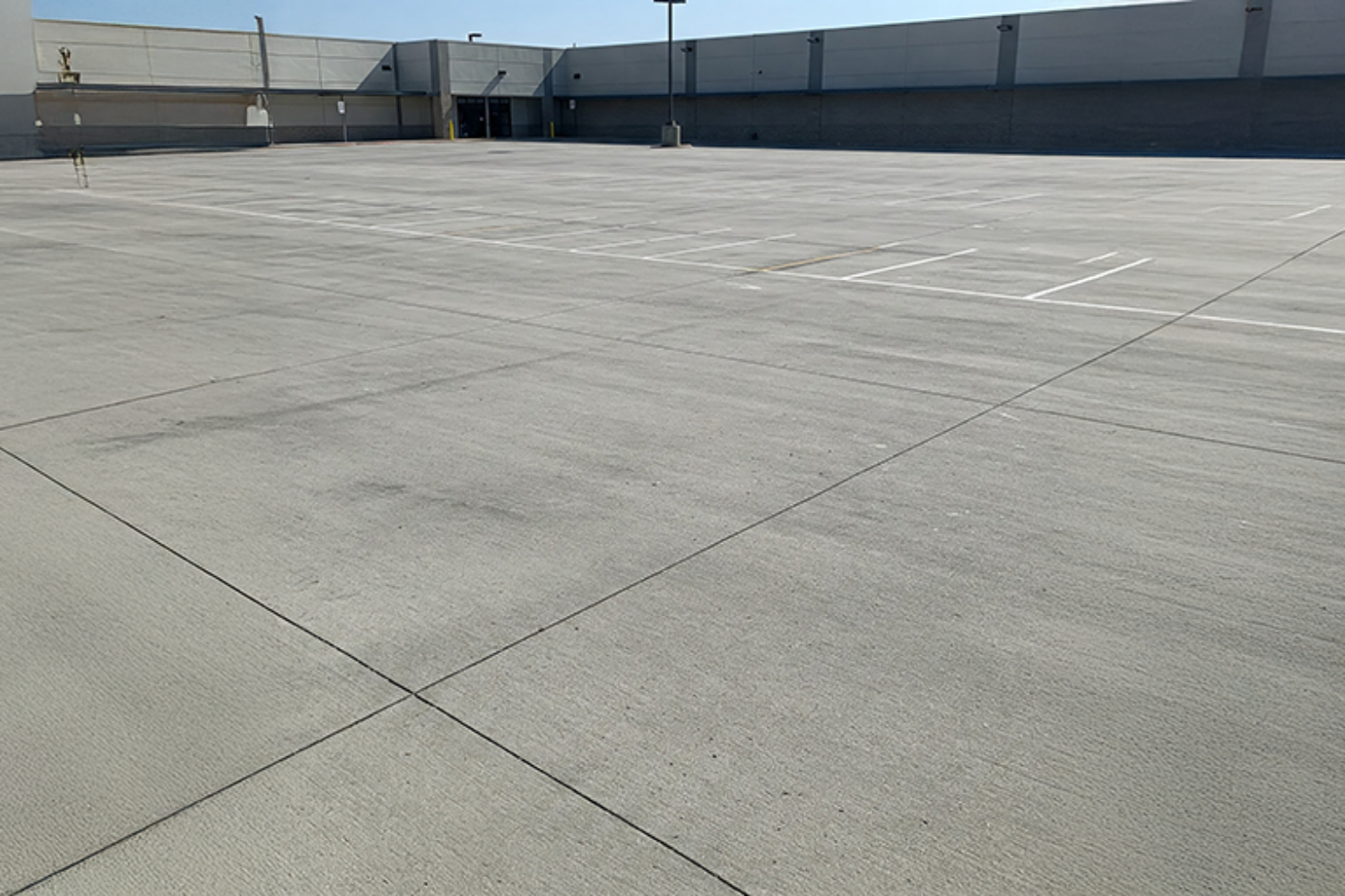 Concrete commercial parking lot.